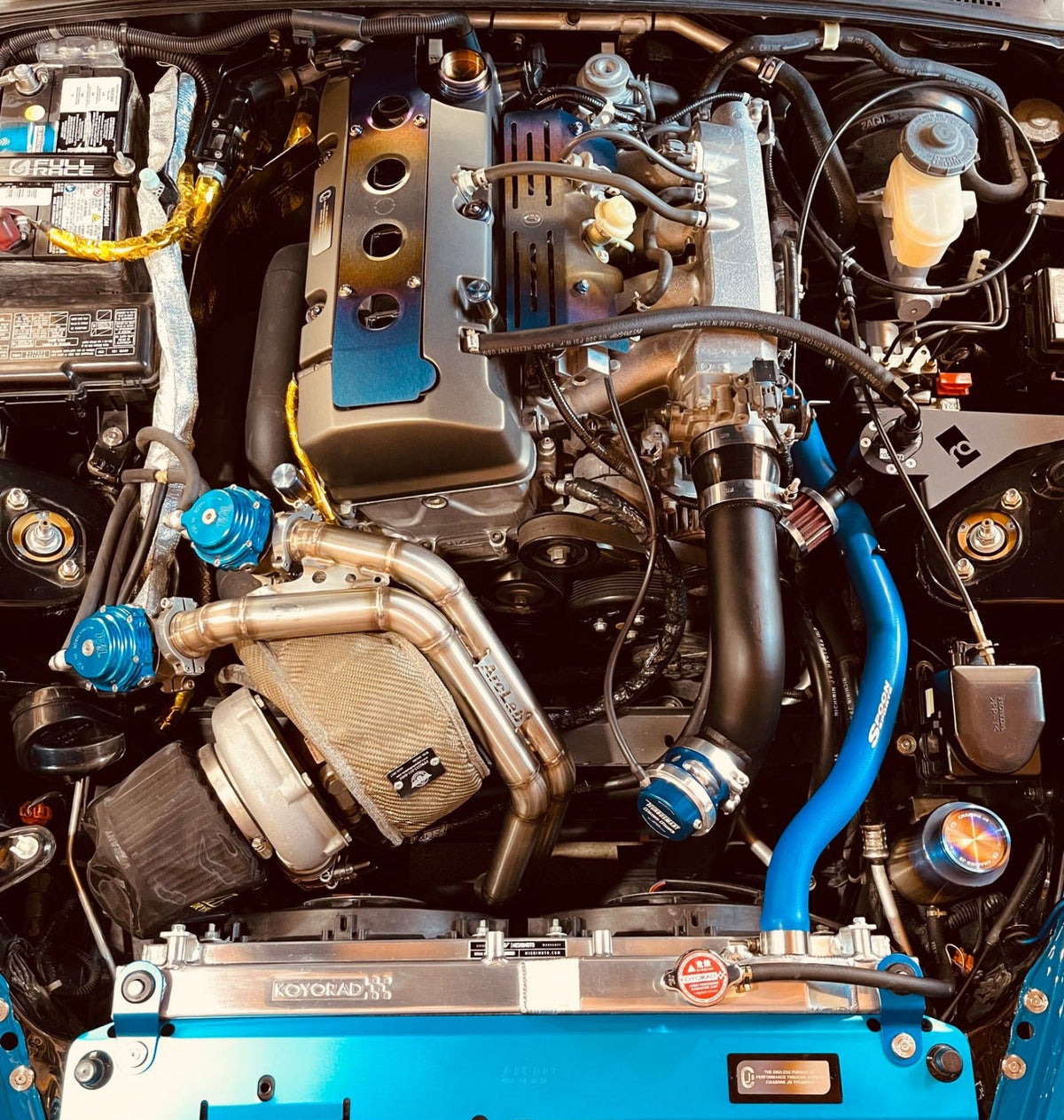 Burnt titanium valve cover hardware on a customer engine