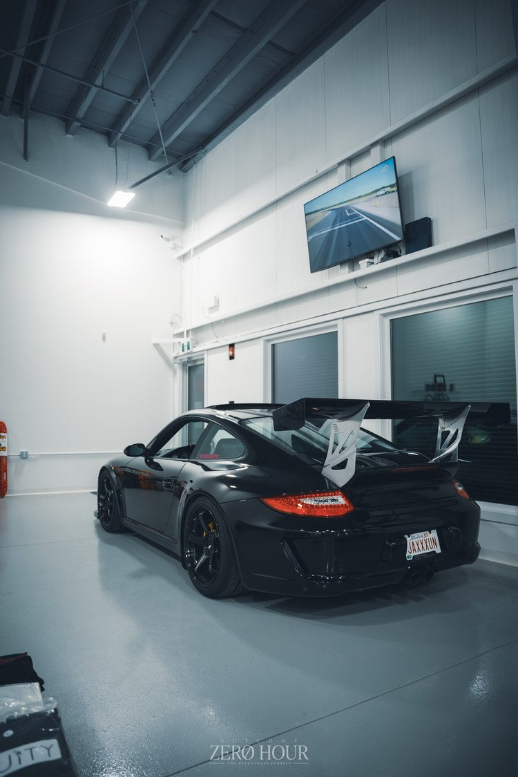 Black Porsche 911 GT3 inside the Speed Factor Calgary shop